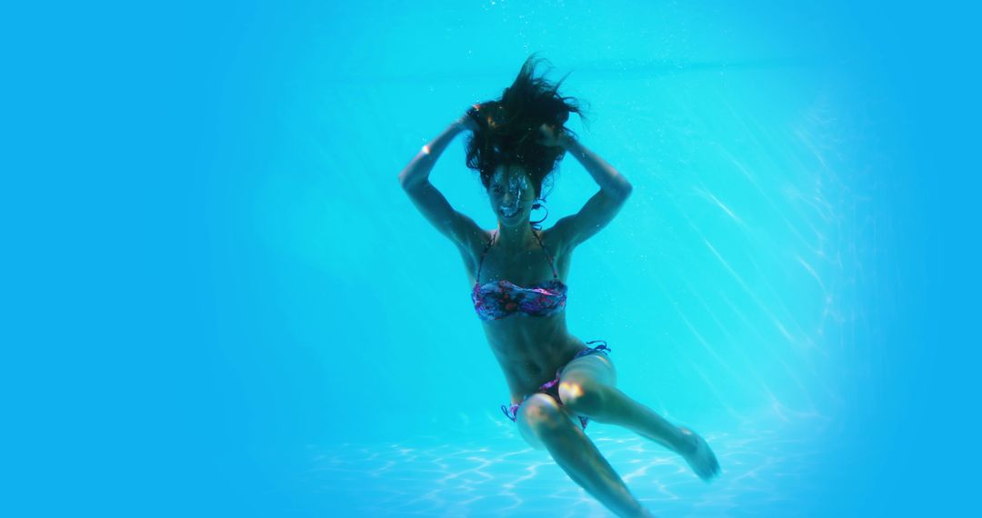 Underwater View of Woman Swimming in Bikini - Free Images, Stock Photos and Pictures on Pikwizard.com