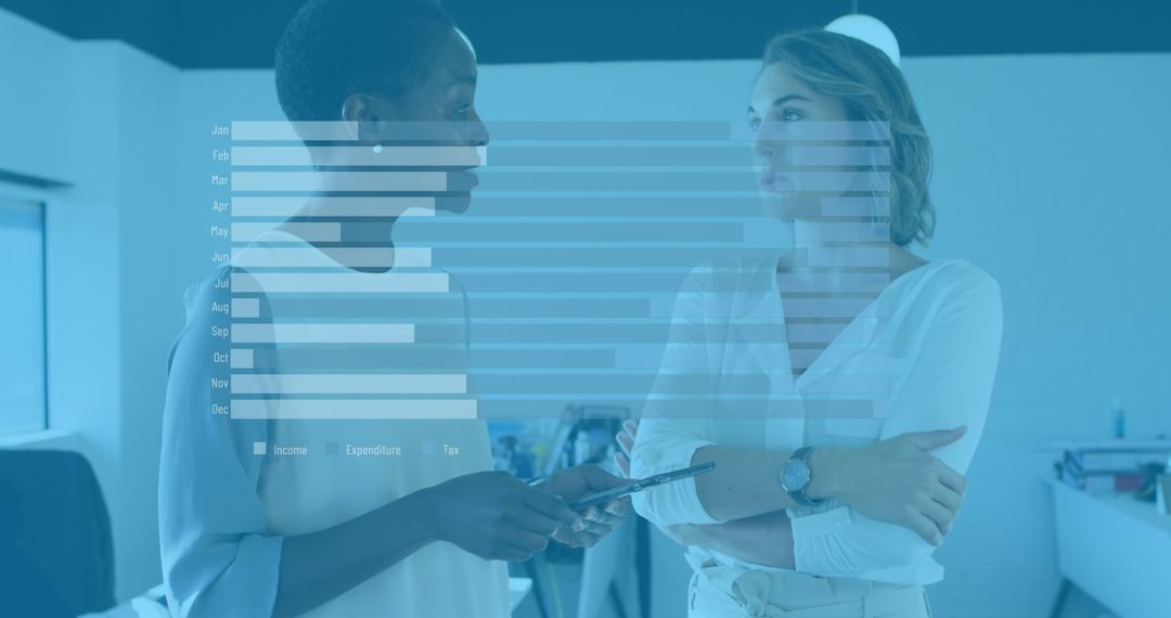 Diverse Businesswomen Analyzing Financial Bar Graphs in Modern Office