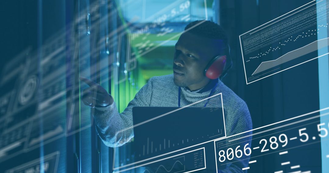 IT Engineer Analyzing Data in High-Tech Server Room