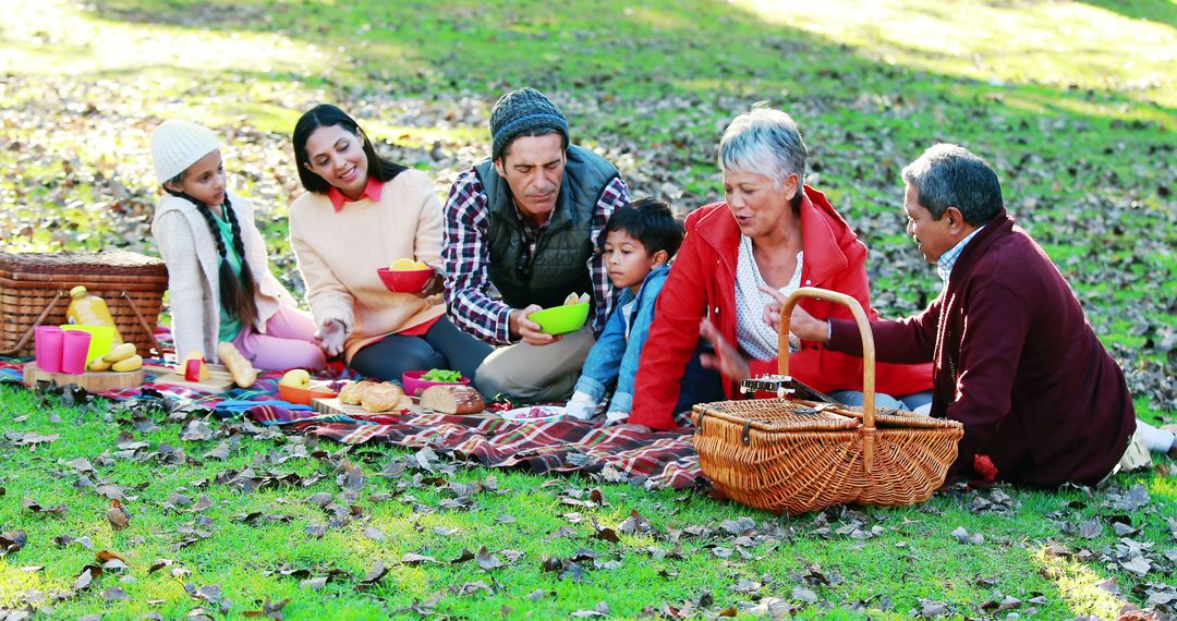 Multigenerational Family Enjoying Autumn Picnic in Park - Free Images, Stock Photos and Pictures on Pikwizard.com