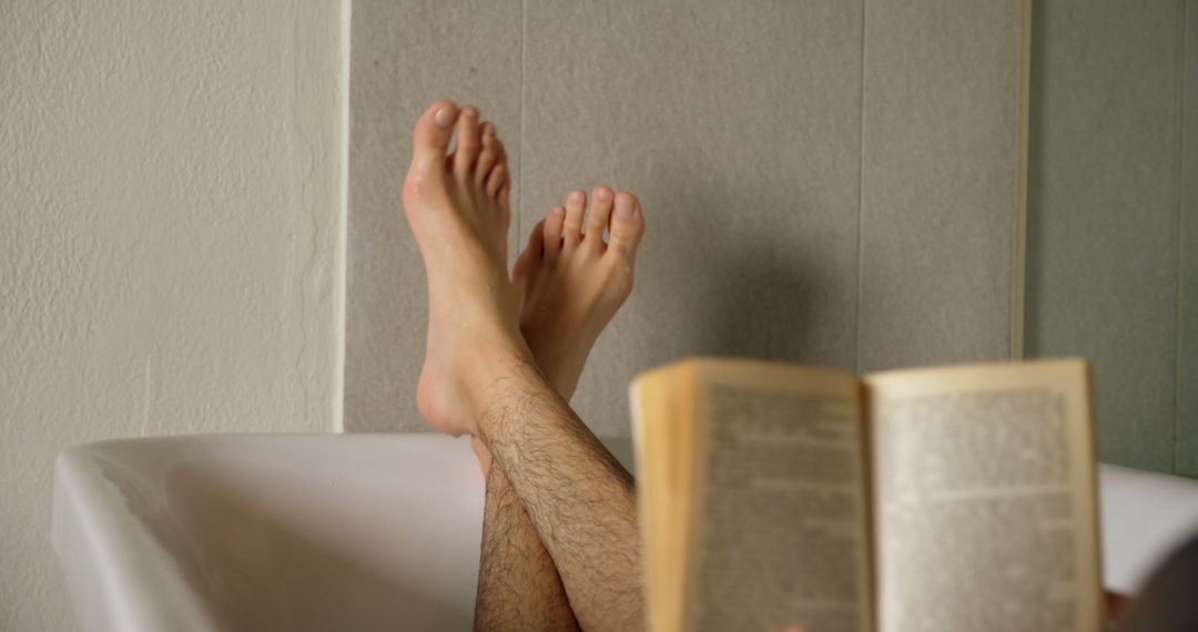 Person Relaxing in Bathtub Reading a Book - Free Images, Stock Photos and Pictures on Pikwizard.com