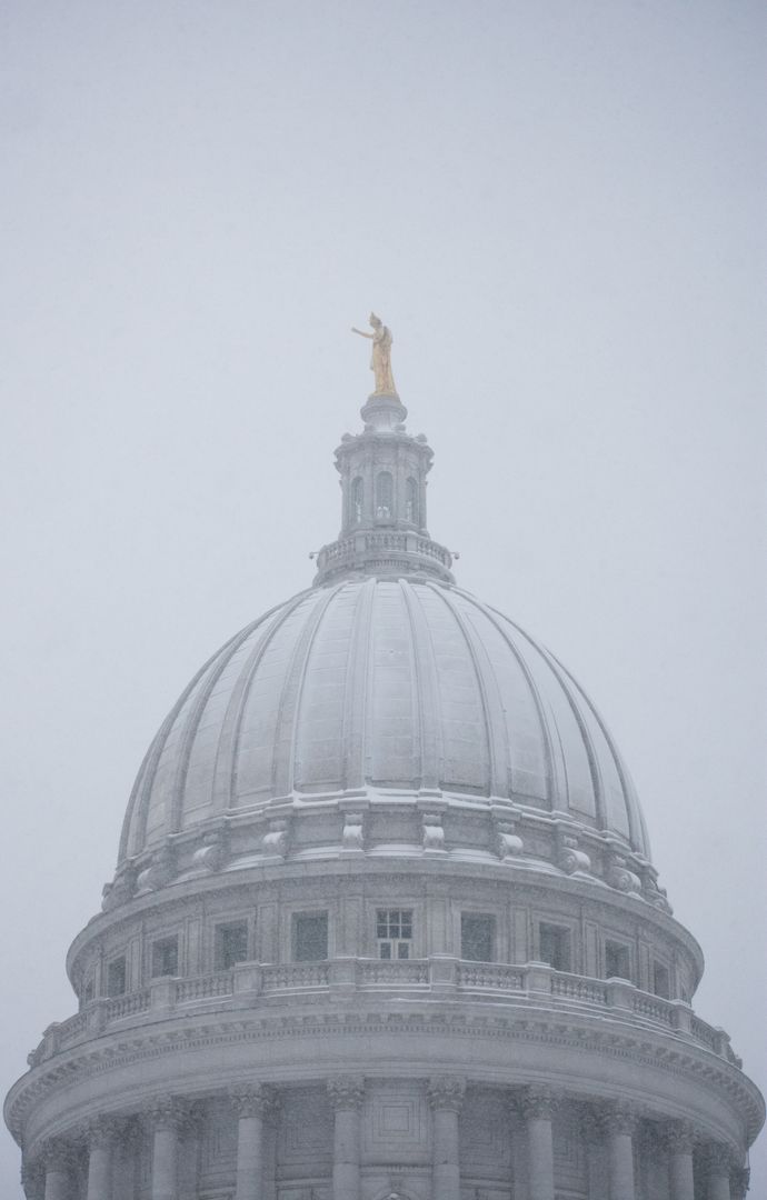 Snowy Dome of Government Building Against Gray Sky - Free Images, Stock Photos and Pictures on Pikwizard.com