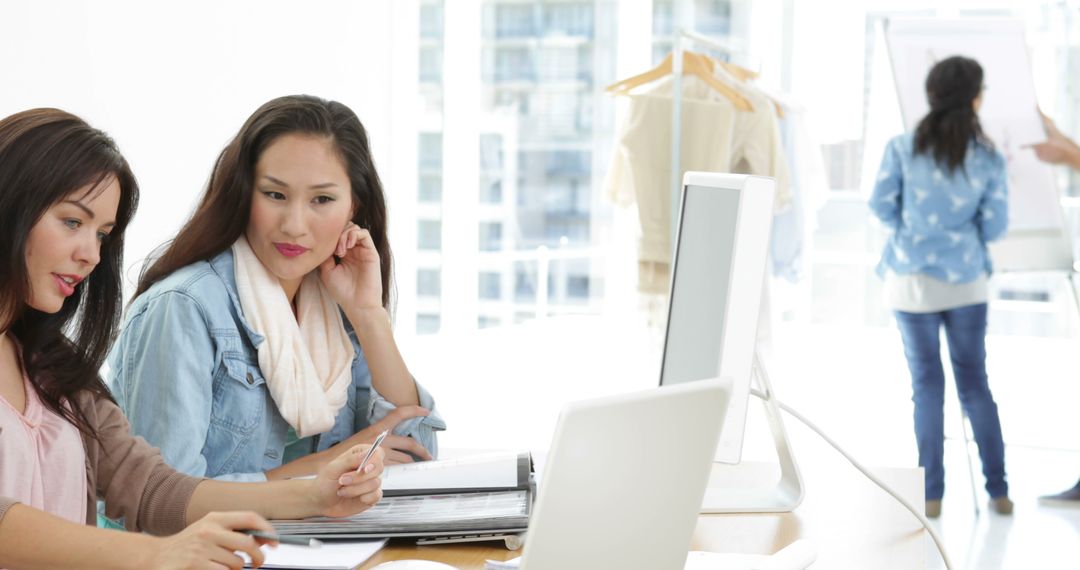 Creative Team Collaborating in Modern Design Studio