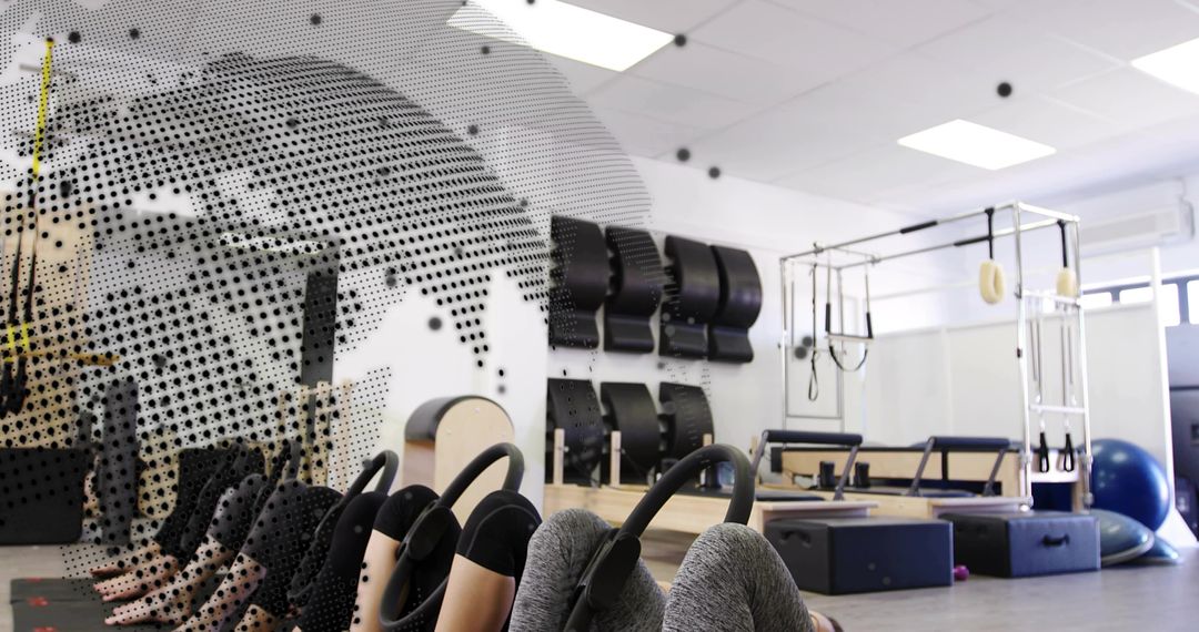 Group Pilates Mat Class Using Rings for Core Strength and Balance in Modern Studio
