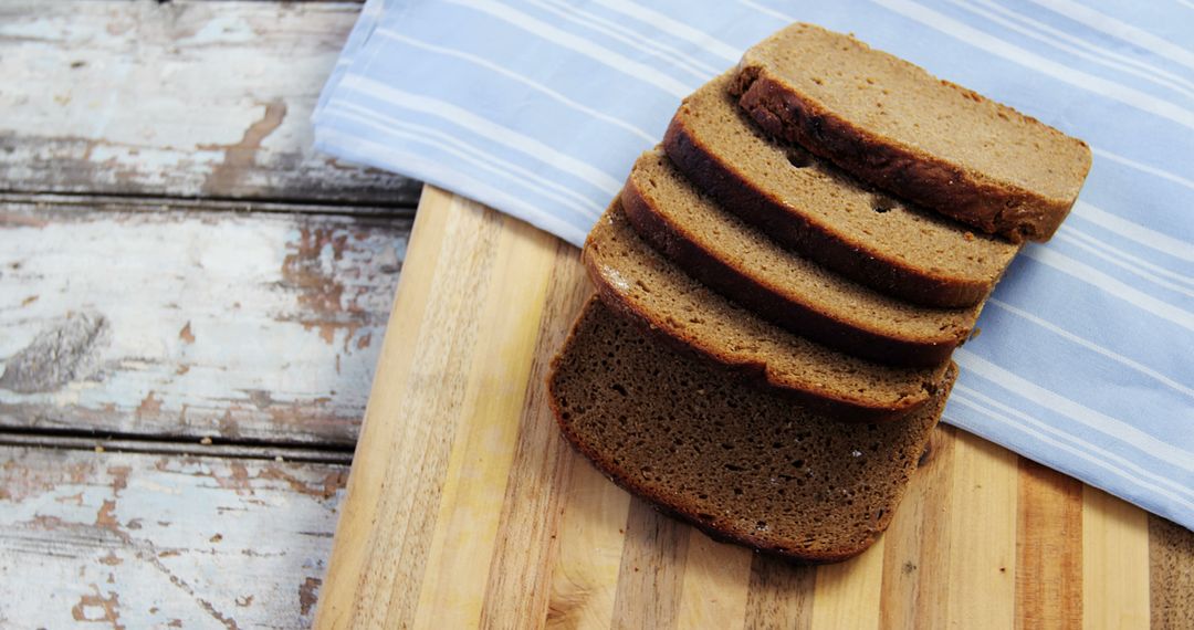 Freshly Sliced Rye Bread on Wooden Cutting Board - Free Images, Stock Photos and Pictures on Pikwizard.com