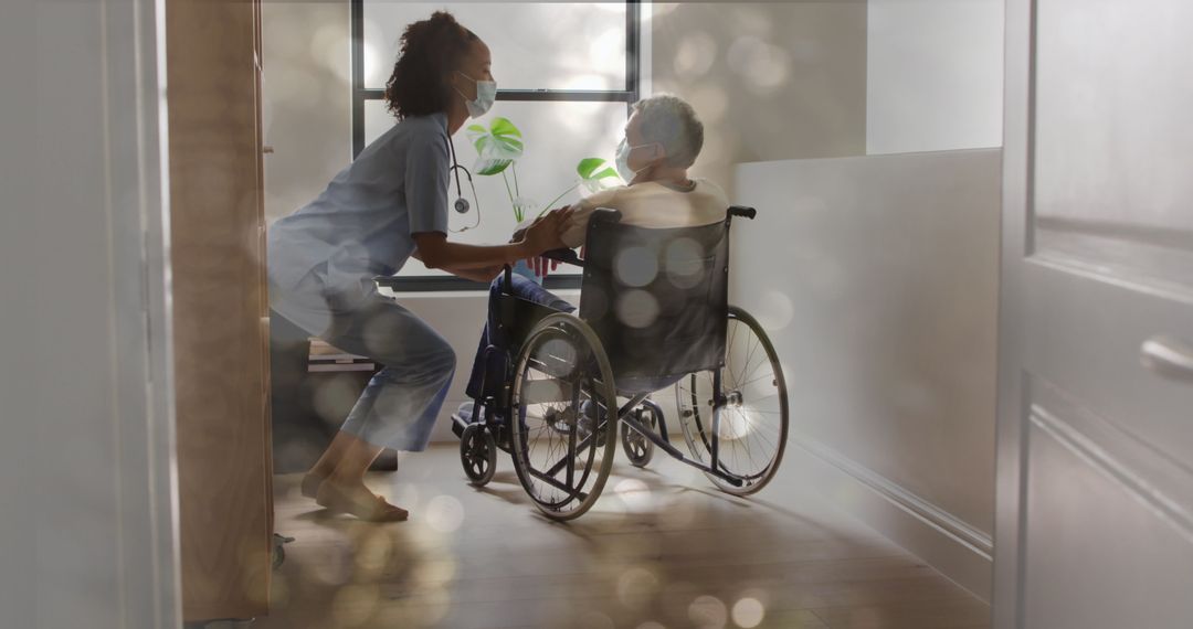 Healthcare Professional Assisting Patient in Wheelchair with Bokeh Effect