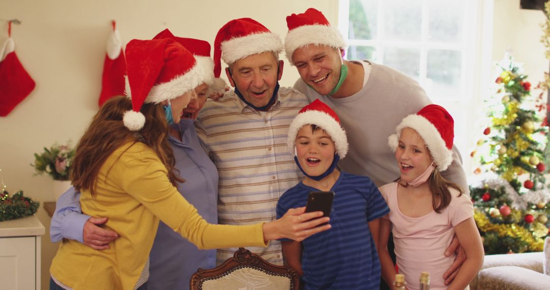 Family Celebrating Christmas in Living Room, Taking Selfie Together - Free Images, Stock Photos and Pictures on Pikwizard.com