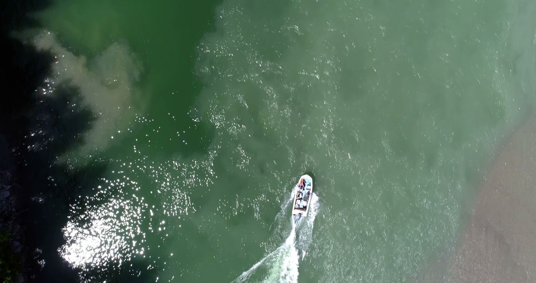 Aerial View of Boat Sailing in Green Waters - Free Images, Stock Photos and Pictures on Pikwizard.com