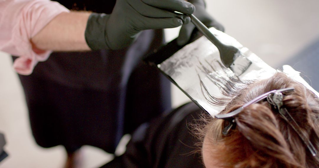 Hairdresser Applying Highlights on Client in Salon - Free Images, Stock Photos and Pictures on Pikwizard.com