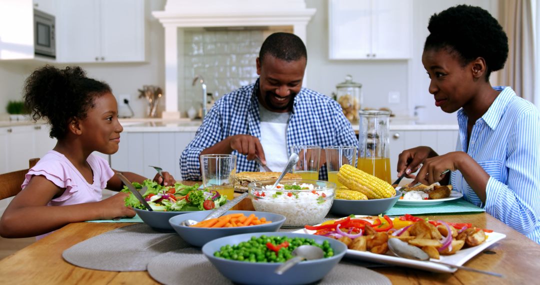 Happy African American Family Enjoying Dinner at Home - Free Images, Stock Photos and Pictures on Pikwizard.com