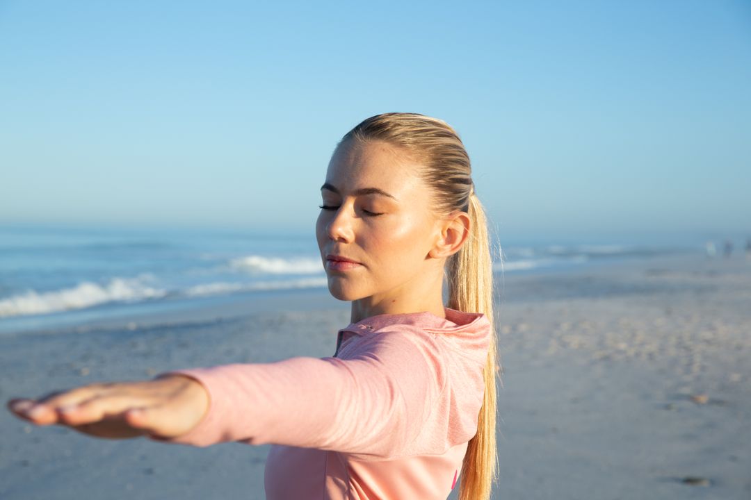 Caucasian Woman Practicing Yoga on Beach with Eyes Closed - Free Images, Stock Photos and Pictures on Pikwizard.com