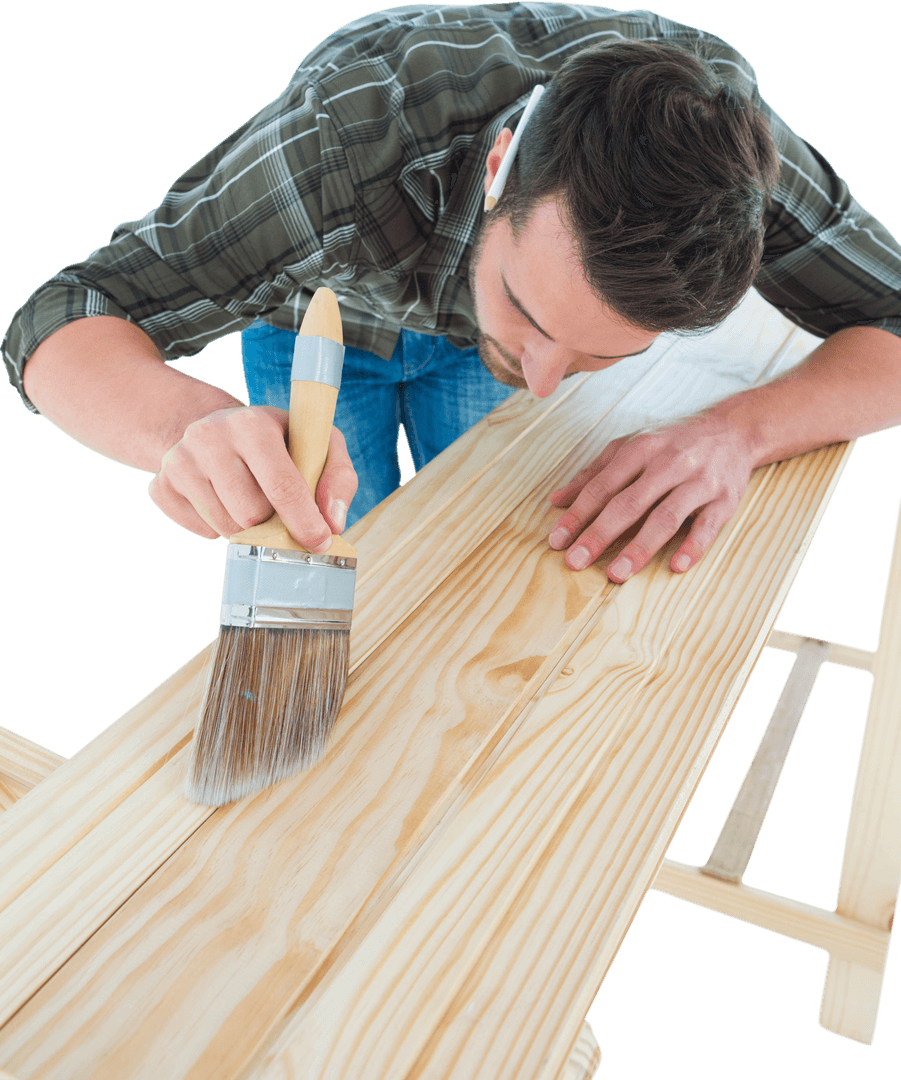 Male Carpenter Using Brush on Transparent Wooden Plank