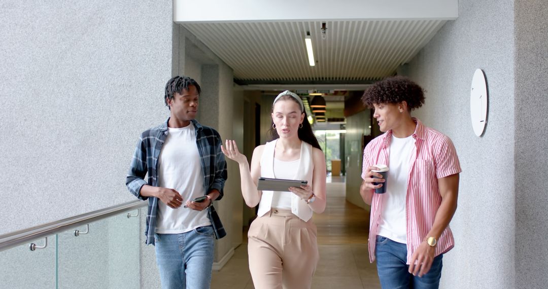 Students Colleagues Discussing Project in School Hallway