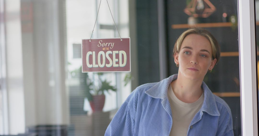 Businesswoman Looking Through Glass Door with Closed Sign - Free Images, Stock Photos and Pictures on Pikwizard.com