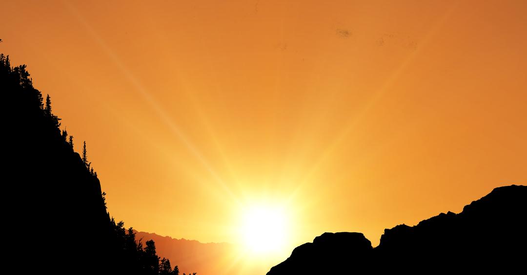 Silhouette mountains with sun shining in background - Free Images, Stock Photos and Pictures on Pikwizard.com