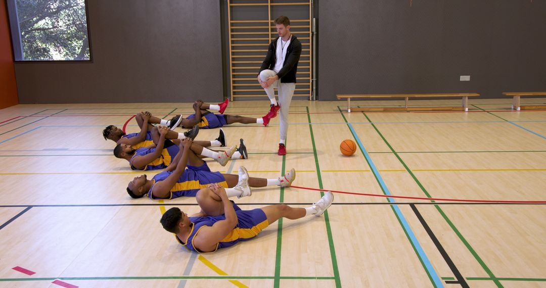 Diverse Basketball Team Stretching During Pre-Game Routine