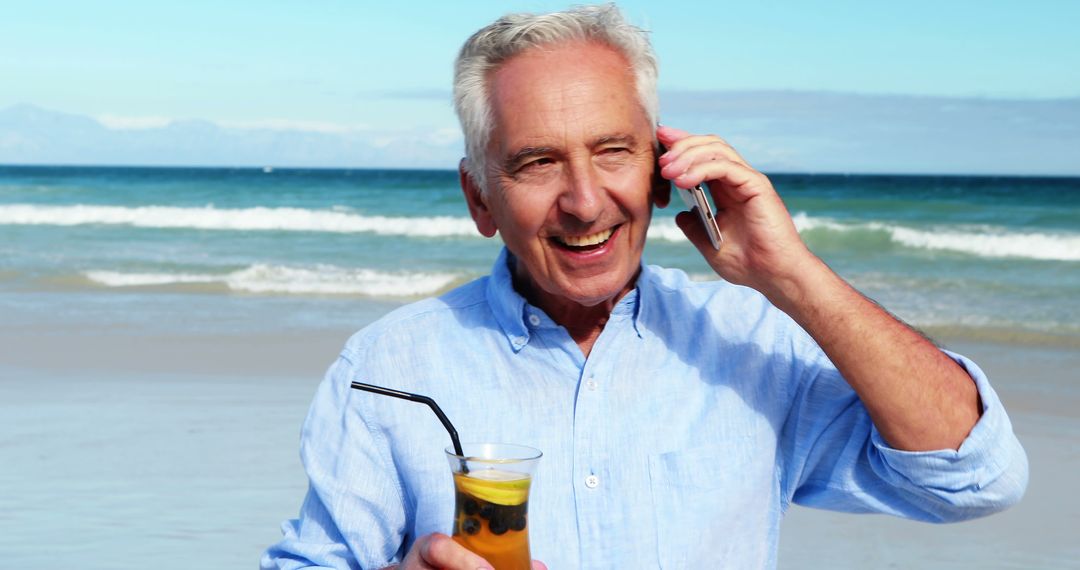 Senior Man Enjoying Beach Vacation While Talking on Phone - Free Images, Stock Photos and Pictures on Pikwizard.com