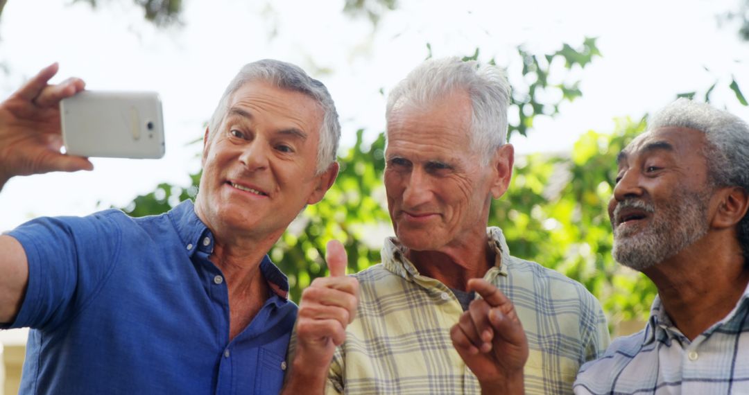 Senior Friends Taking Selfie and Smiling Outdoors - Free Images, Stock Photos and Pictures on Pikwizard.com