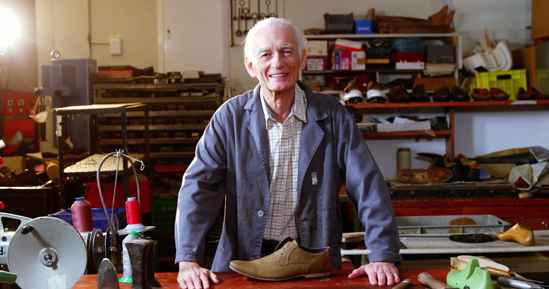 Smiling Elderly Shoemaker in Workshop with Tools and Shoes - Free Images, Stock Photos and Pictures on Pikwizard.com