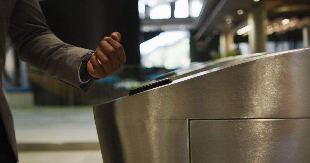 Person Using Smartwatch to Access Secure Turnstile Entrance - Free Images, Stock Photos and Pictures on Pikwizard.com