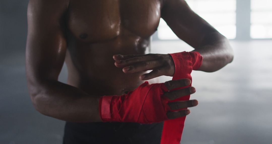 Athlete Wrapping Hands in Red Boxing Wraps at Gym - Free Images, Stock Photos and Pictures on Pikwizard.com