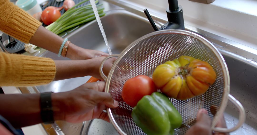 Couple Washing Fresh Vegetables in Kitchen Sink Together - Free Images, Stock Photos and Pictures on Pikwizard.com