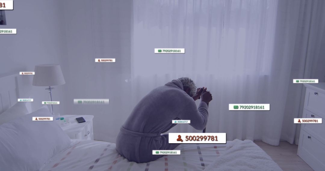 Stressed Man Holding Head in Modern Bedroom with Overlay Data