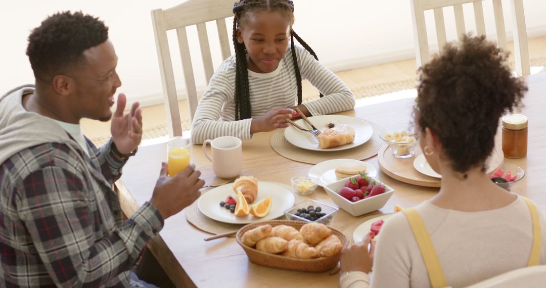 Happy African American Family Eating Breakfast Together at Home - Free Images, Stock Photos and Pictures on Pikwizard.com