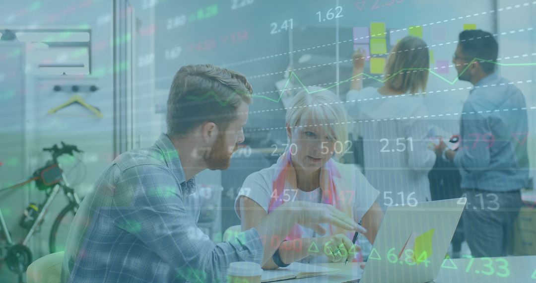 Colleagues Analyzing Data Overlay in Modern Office