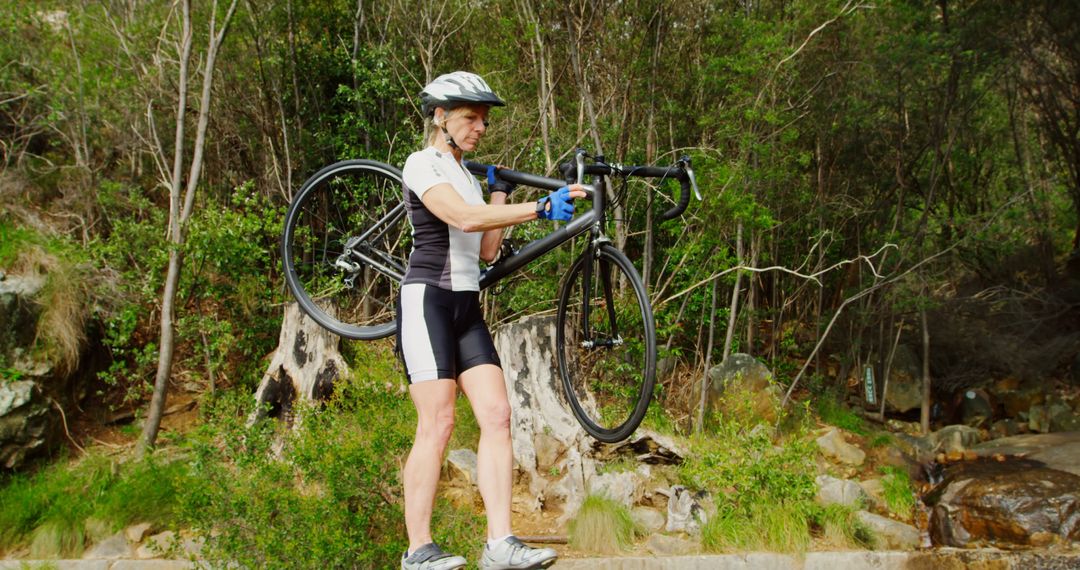 Woman Carrying Bicycle Through Forest Trail - Free Images, Stock Photos and Pictures on Pikwizard.com