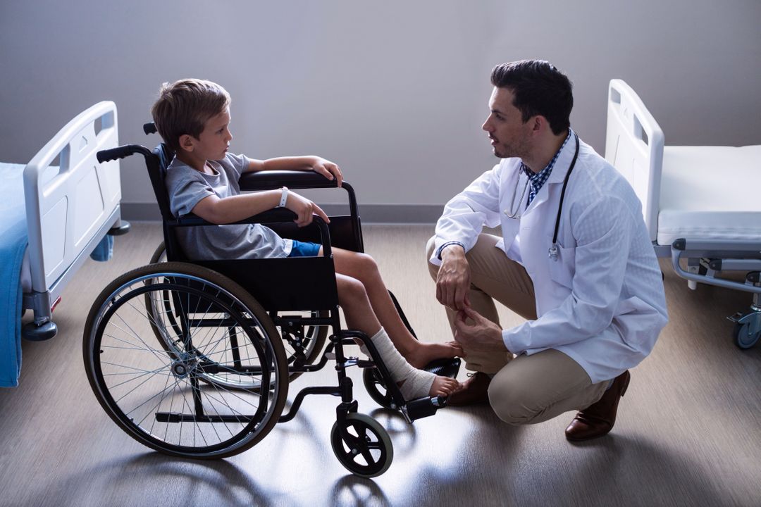 Male doctor interacting with child patient in ward - Free Images, Stock Photos and Pictures on Pikwizard.com