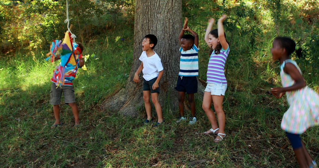 Children playing piñata game in park - Free Images, Stock Photos and Pictures on Pikwizard.com