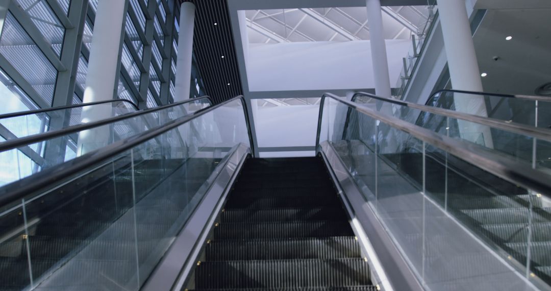 Modern Glass-Walled Escalator with Architectural Interior - Free Images, Stock Photos and Pictures on Pikwizard.com