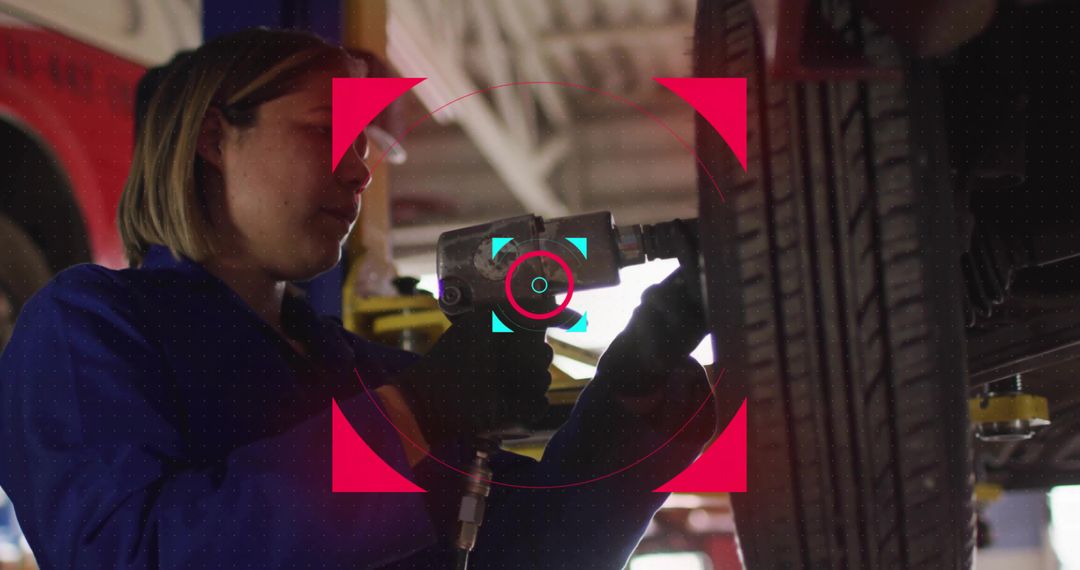 Mechanic Removing Lug Nuts with Air Impact Wrench in Service Bay