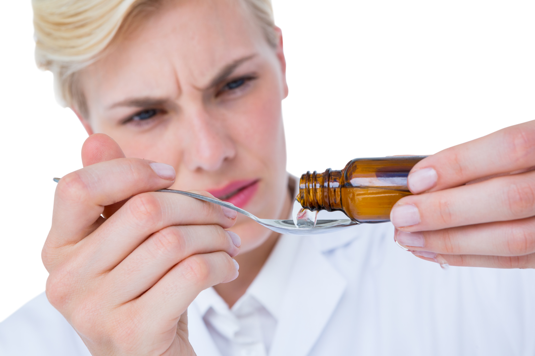 Doctor Pouring Medicine on Spoon with Focused Expression, Transparent Background - Download Free Stock Images Pikwizard.com