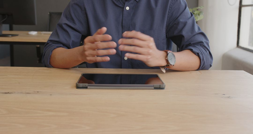 Business Professional Gesturing During Tablet Presentation