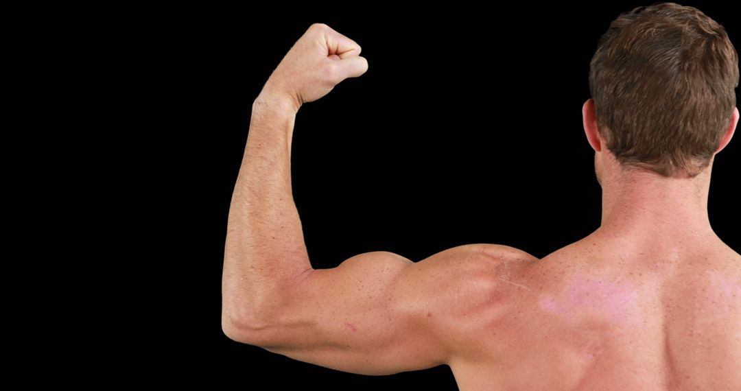 Muscular Man Flexing Arm displaying Strength and Fitness against Black Background - Free Images, Stock Photos and Pictures on Pikwizard.com