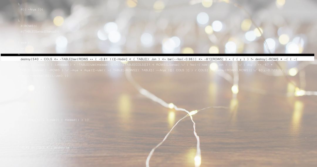 Warm white LED fairy lights glowing on wooden tabletop with bokeh and code overlay