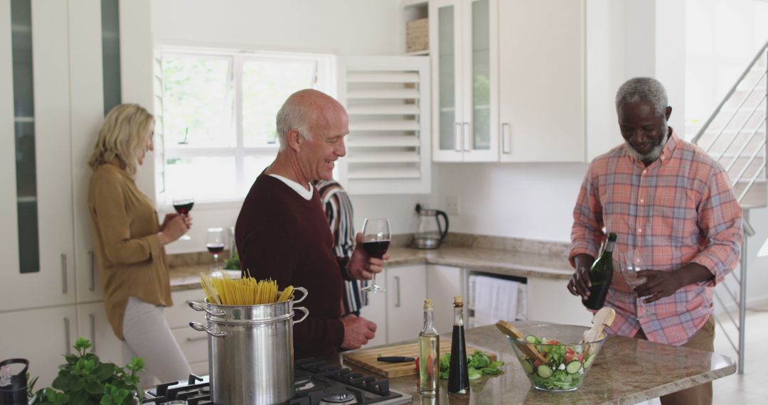 Senior Couples Socializing in Kitchen While Cooking Dinner
