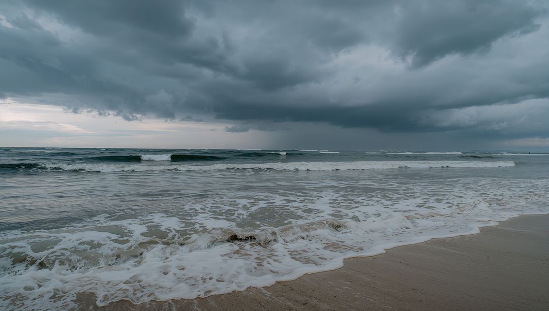 Thunderous Ocean Waves Crashing Against Scenic Shoreline