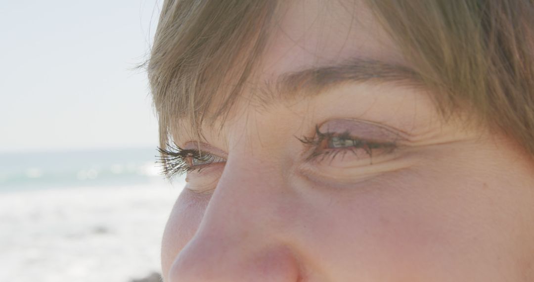 Close-up of Woman's Eyes with Ocean in Background - Free Images, Stock Photos and Pictures on Pikwizard.com