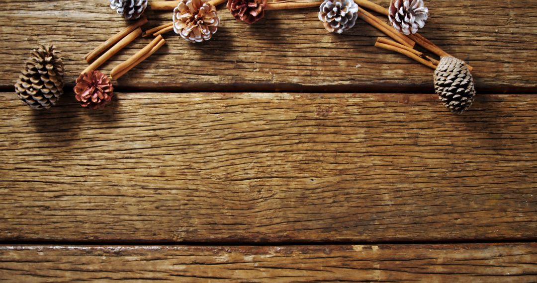 Rustic Wooden Background with Pine Cones and Cinnamon Sticks for Autumn Decor - Free Images, Stock Photos and Pictures on Pikwizard.com