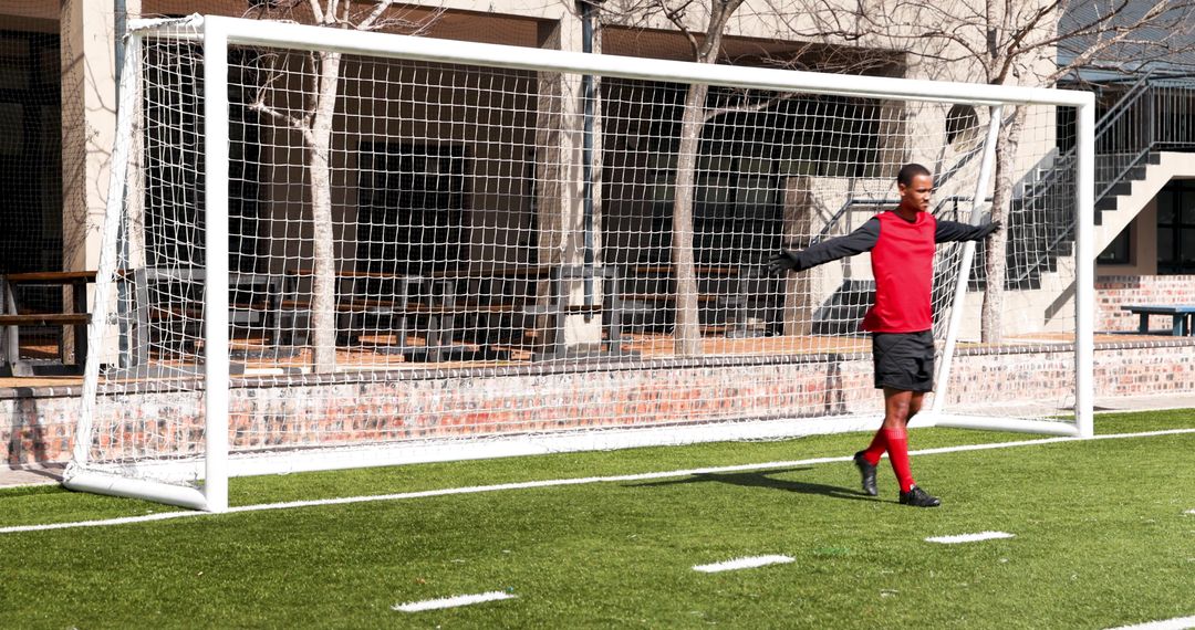 Young Athlete Practicing Soccer Skills on Turf Field