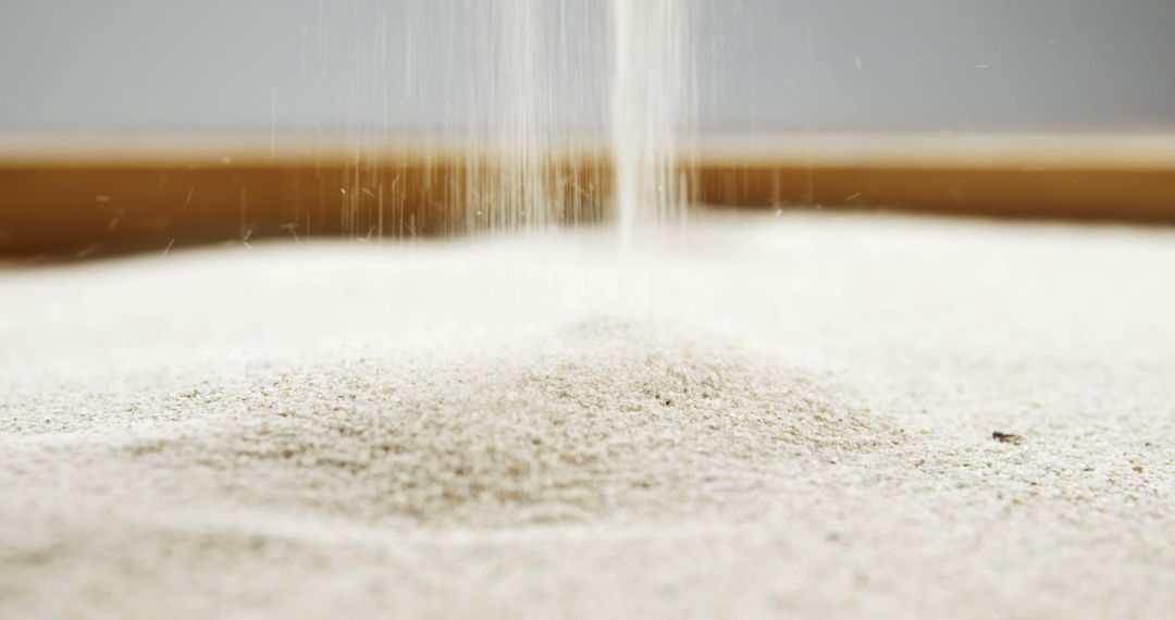 Close-Up of Fine Sand Falling in Pile - Free Images, Stock Photos and Pictures on Pikwizard.com