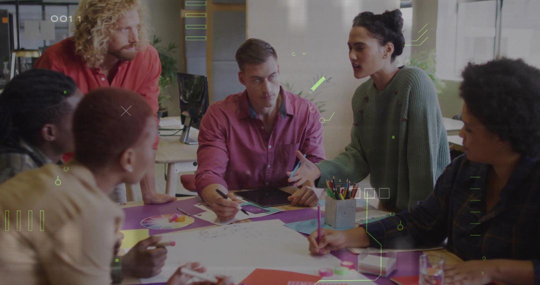 Diverse Team Collaborating Over Creative Project in Office