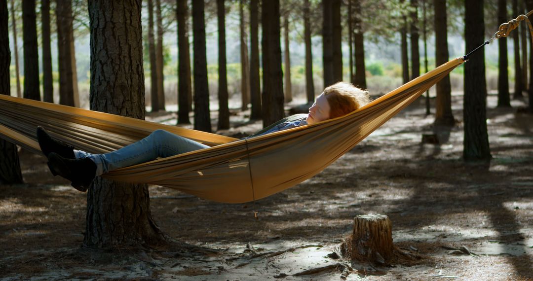 Young Woman Relaxing in Hammock in Sunlit Forest - Free Images, Stock Photos and Pictures on Pikwizard.com