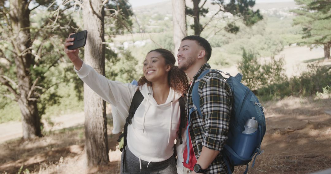 Happy Couple Taking Selfie During Forest Hike
