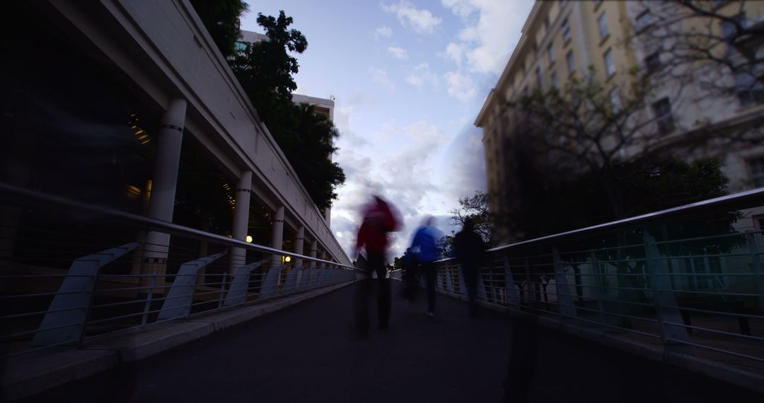 Blurred Silhouettes Walking through Urban Street at Dusk - Free Images, Stock Photos and Pictures on Pikwizard.com