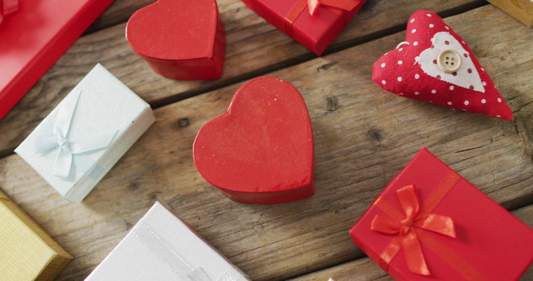 Heart-Shaped Boxes and Festive Gifts on Wooden Surface