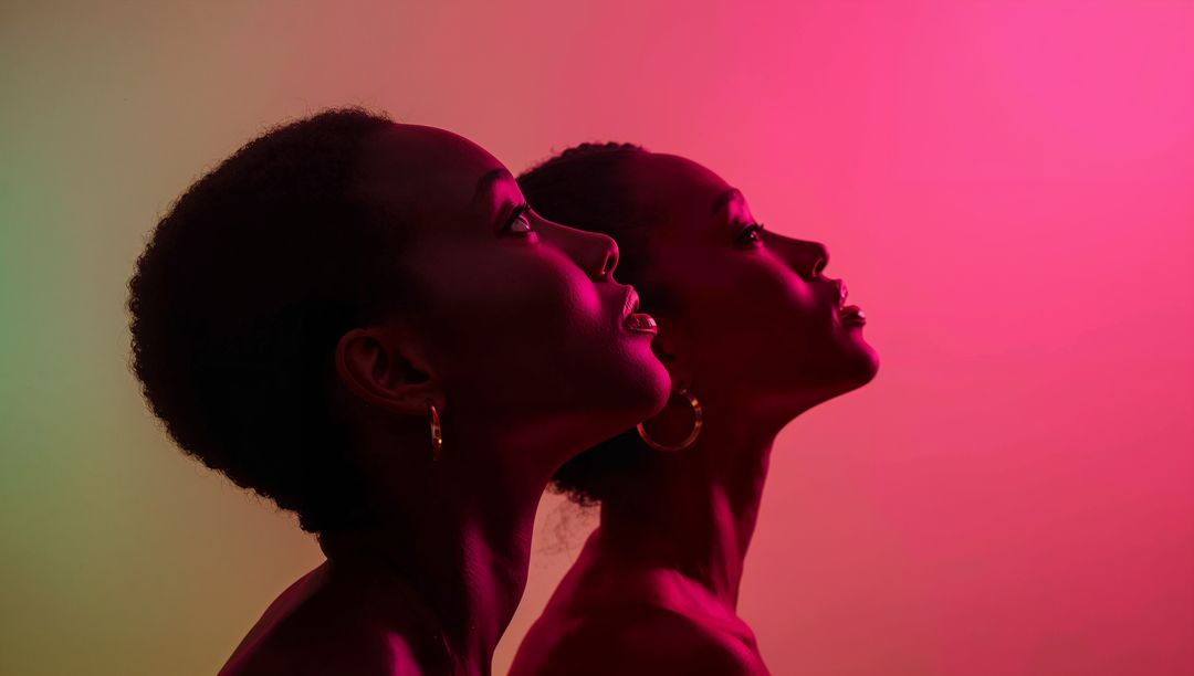 Artistic Portrait of Models in Gradient Lighting with Futuristic Glow